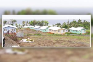 Two families  already in houses built by volunteers at Orange Hill