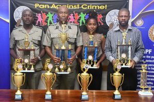 Police Force receives donation of trophies for Christmas Caroling Contest