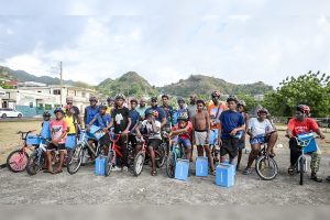 Barrouallie pedal cyclists receive head gear