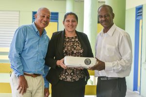 SVG EX Teachers present movie projector to J.P Eustace Memorial